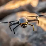 Professional camera drone hovering with its landing gear deployed